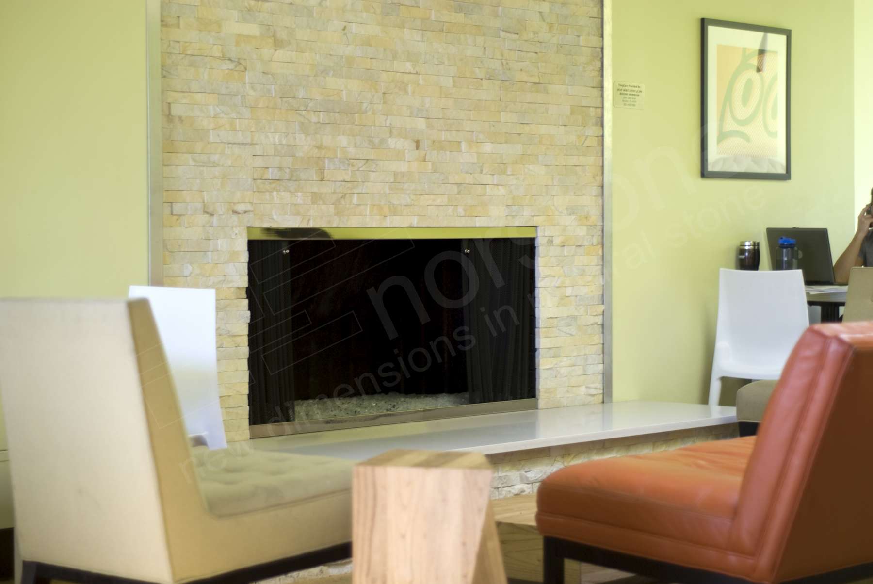 Norstone Ivory Stacked Stone Rock Panels featured on a fireplace application in a coffee shop in Denver, CO